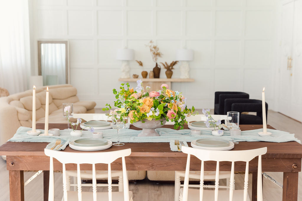 A beautiful scene of table decorations demonstrates how Bluum Maison products can be used.