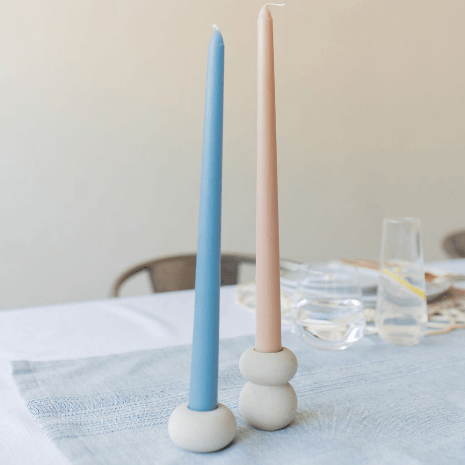summerville oasis candlestick duo one candle is a neutral colour the other a blue colour