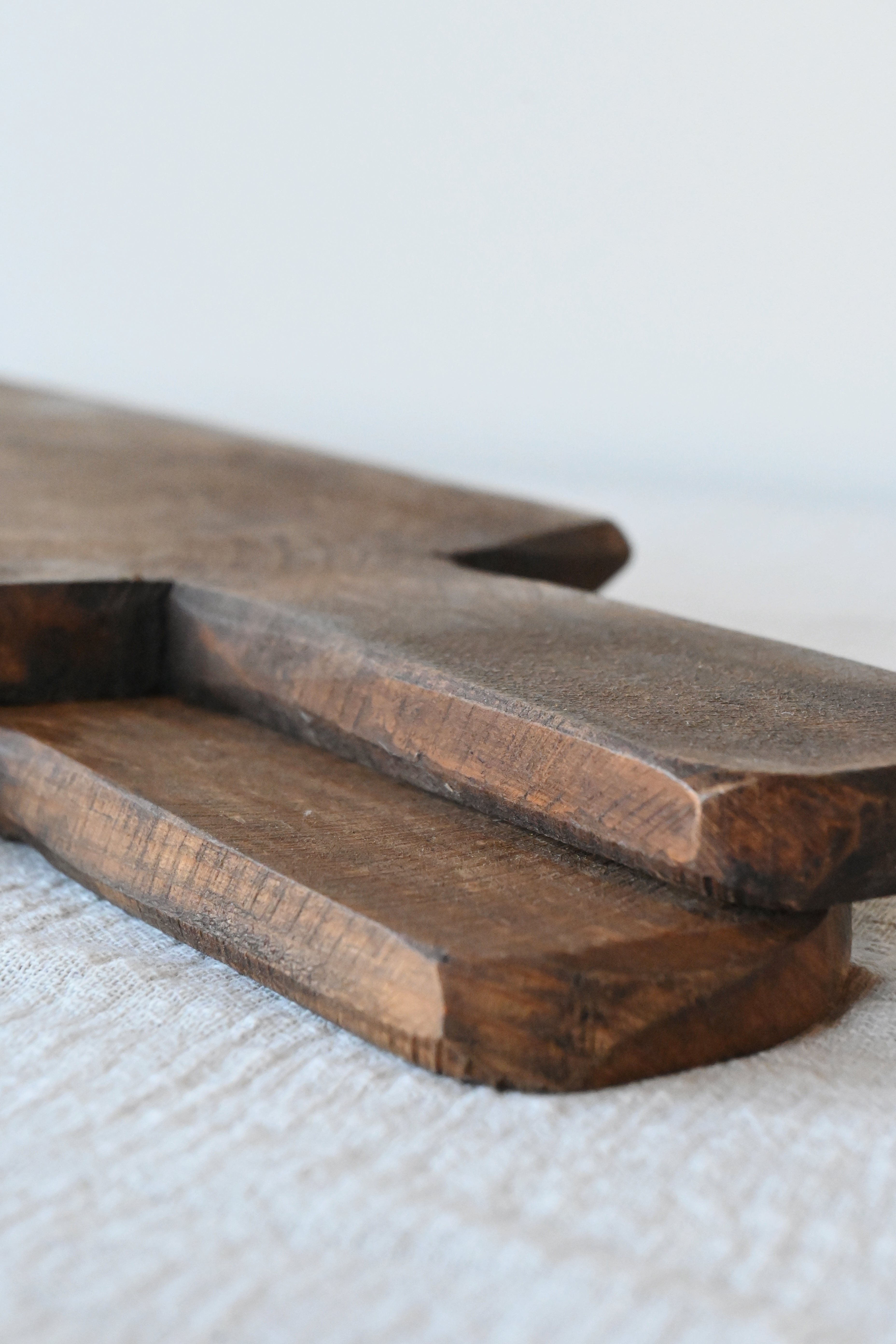 a close-up look of the dark mango wood boards used for kitchen decor or charcuterie boards