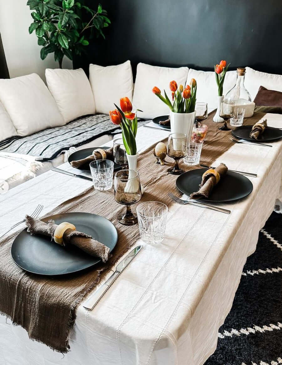 black table plates with brown linen table runner and brown linen table napkins