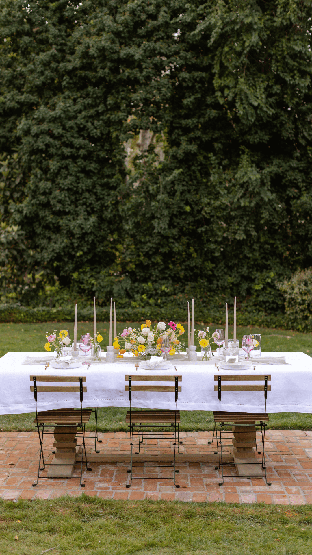instagram feature of outdoor french chairs and our white linen table runner and napkins set and candlesticks